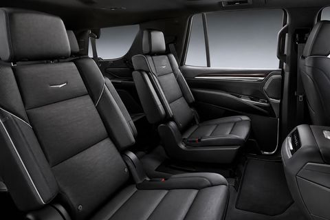 Luxury black leather passenger interior of a Cadillac Escalade ESV used by Stellar Executive Transport in Calgary.
